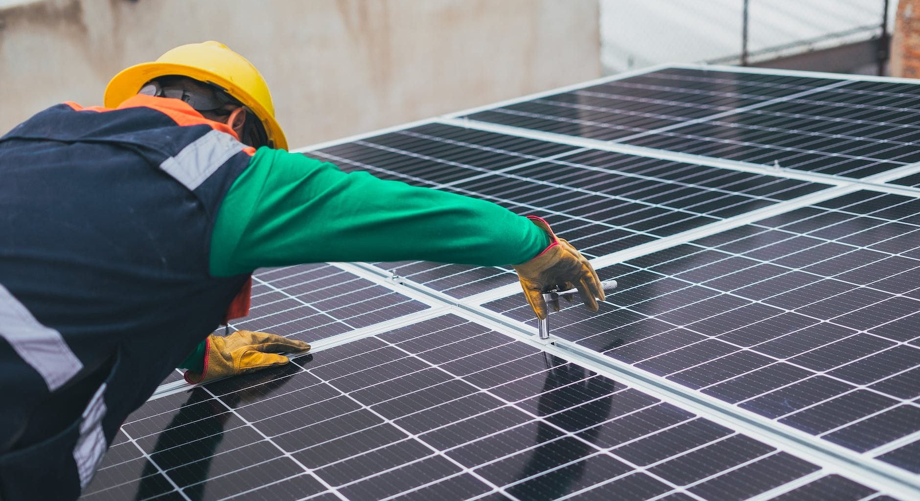 solar technician installing solar panel