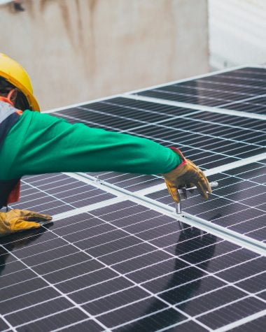 solar technician installing solar panel