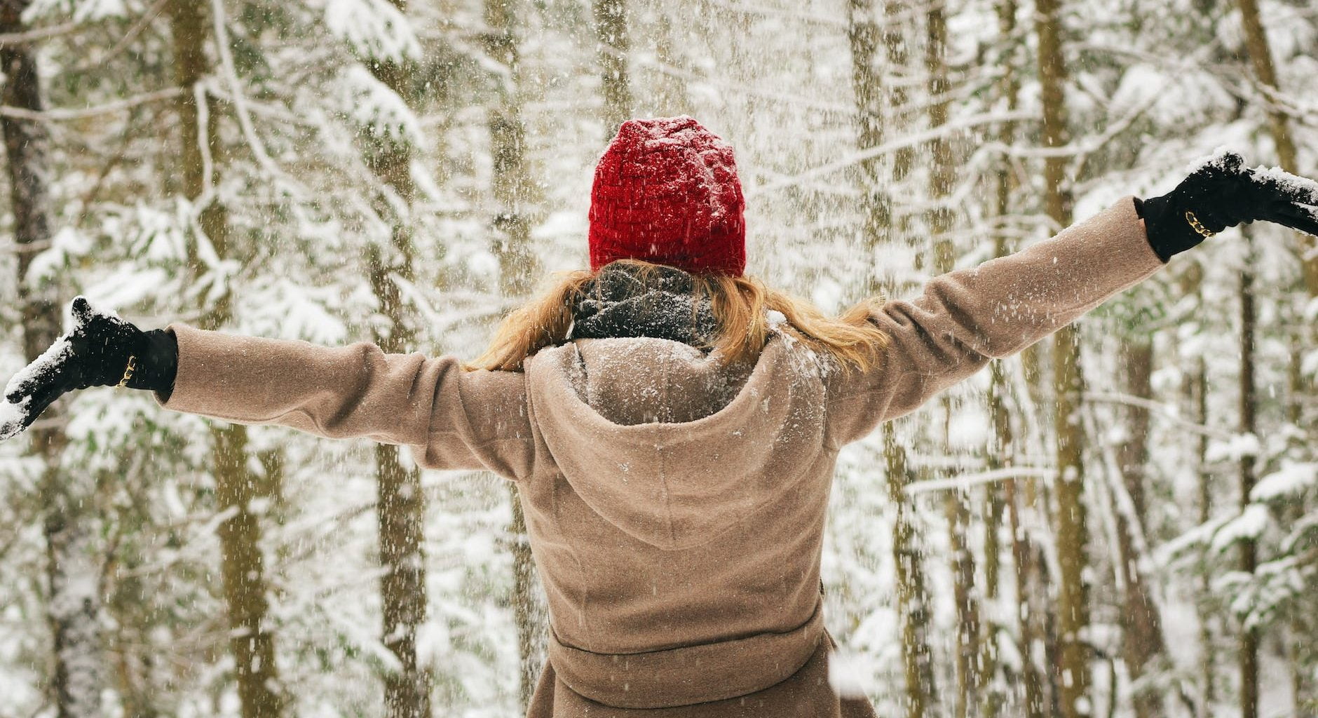 woman wearing brown coat